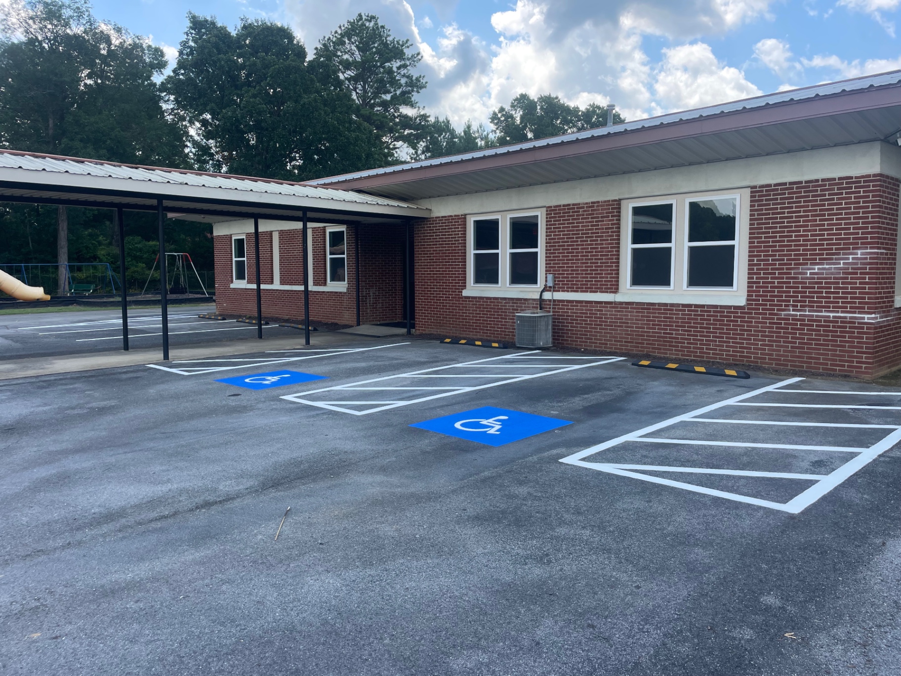 School parking lot with fresh ADA markings