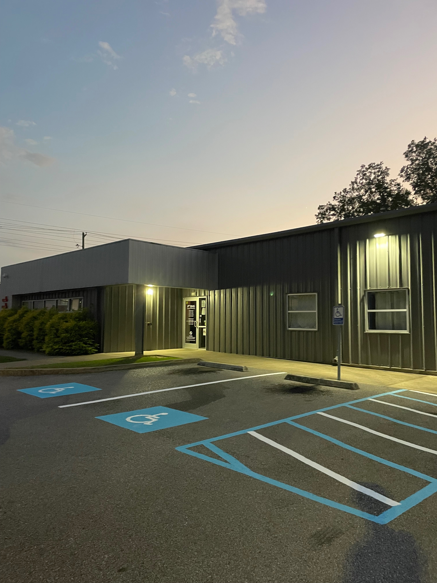 Fresh ADA accessible parking spaces at dusk